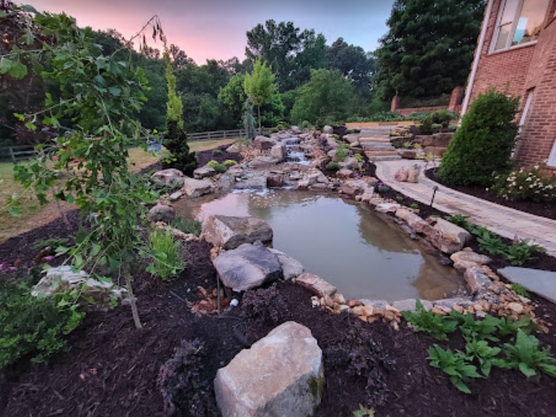 McCoy koi waterfall and pond at sunset