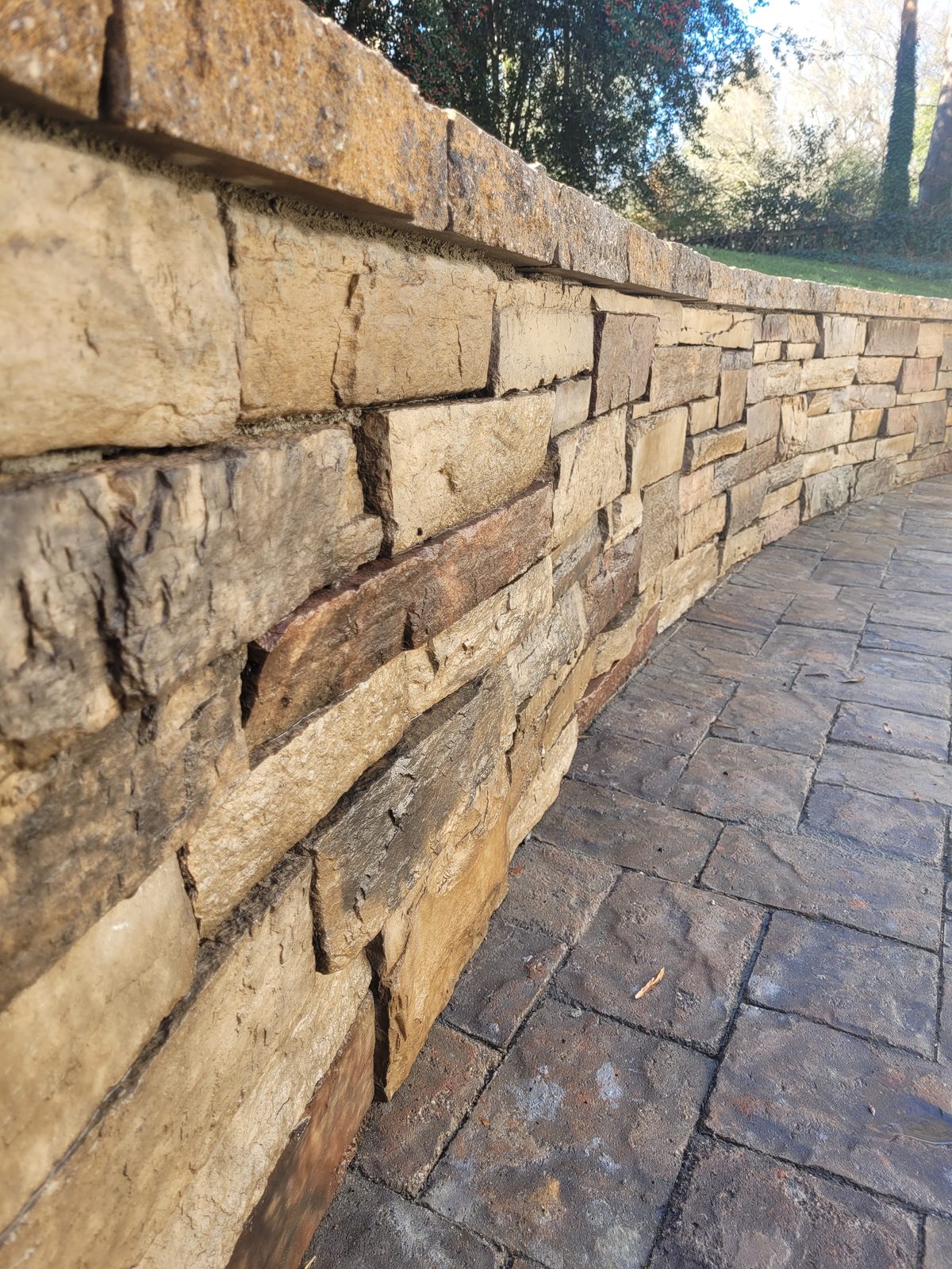 Close detail of stacked-stone wall craftsmanship at the Matthews Mill House project