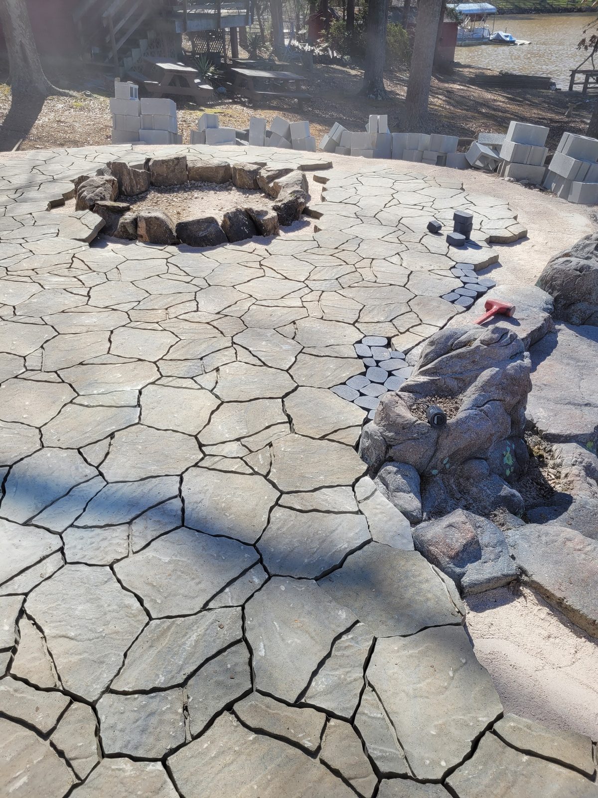 Flagstone patio and fire pit with a lake view at Lake Tillery